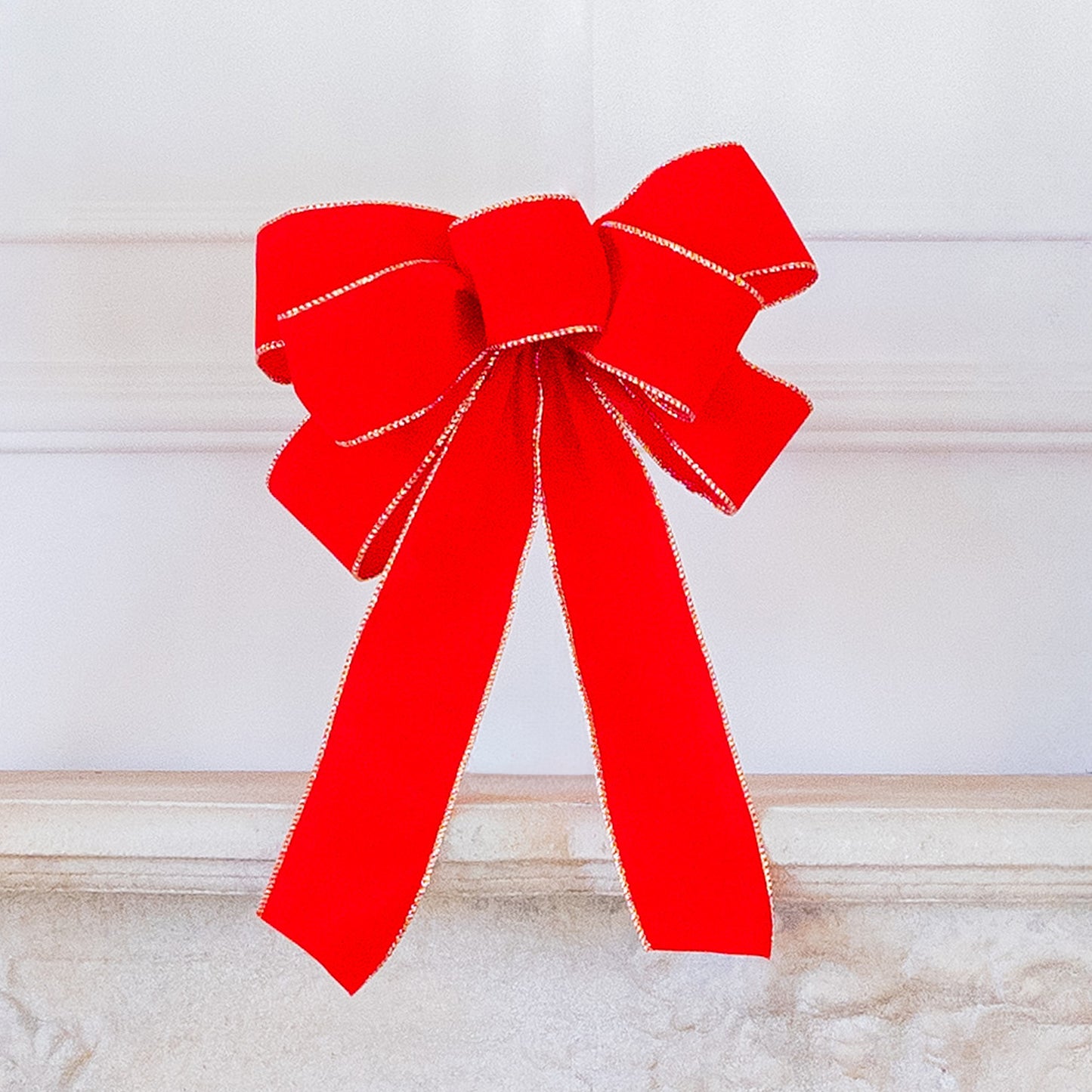 Red Bow trimmed in gold