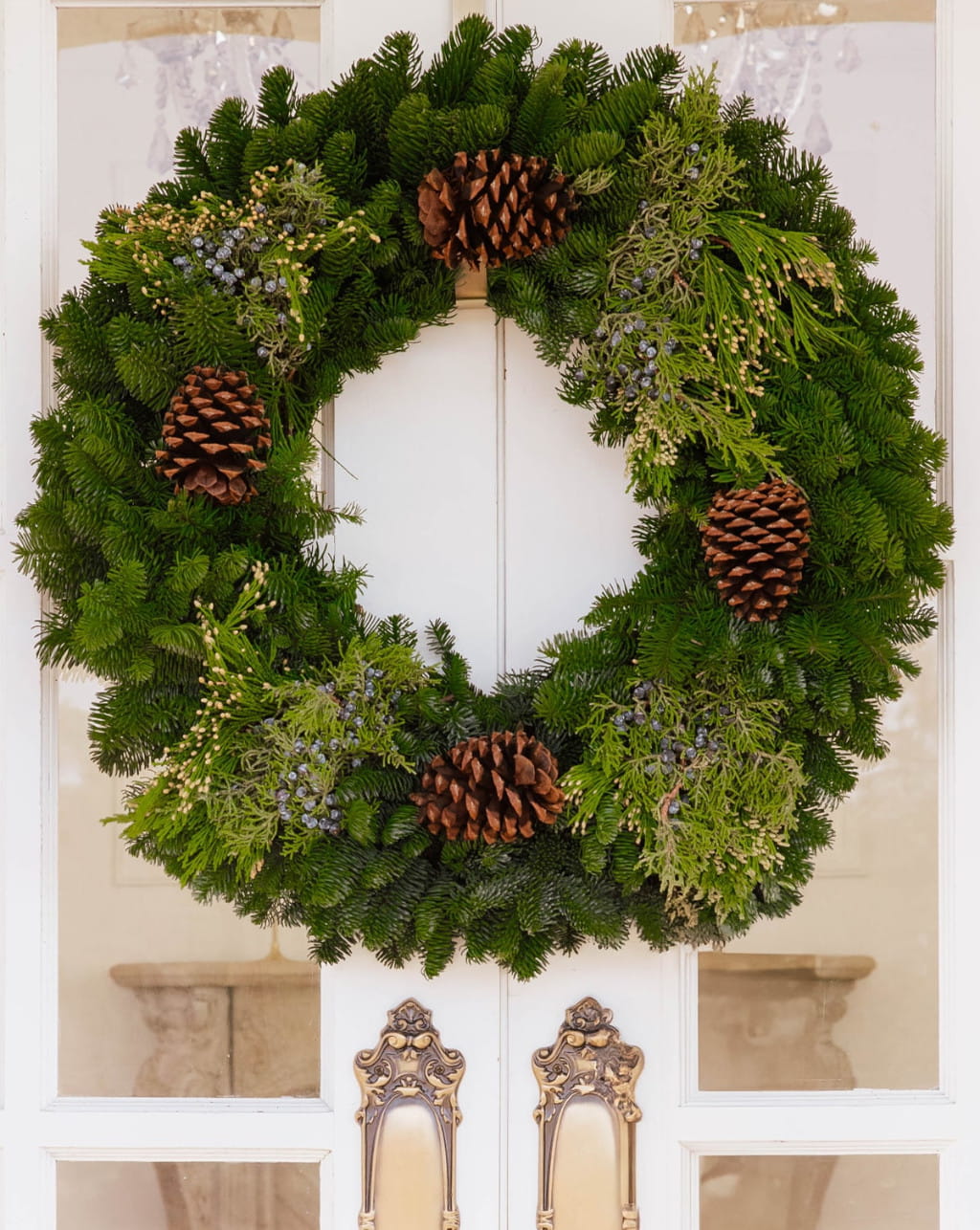 Glade wreath with pine cones fresh greenery available in 20 to 48 inch sizes for Christmas decor and front door decoration