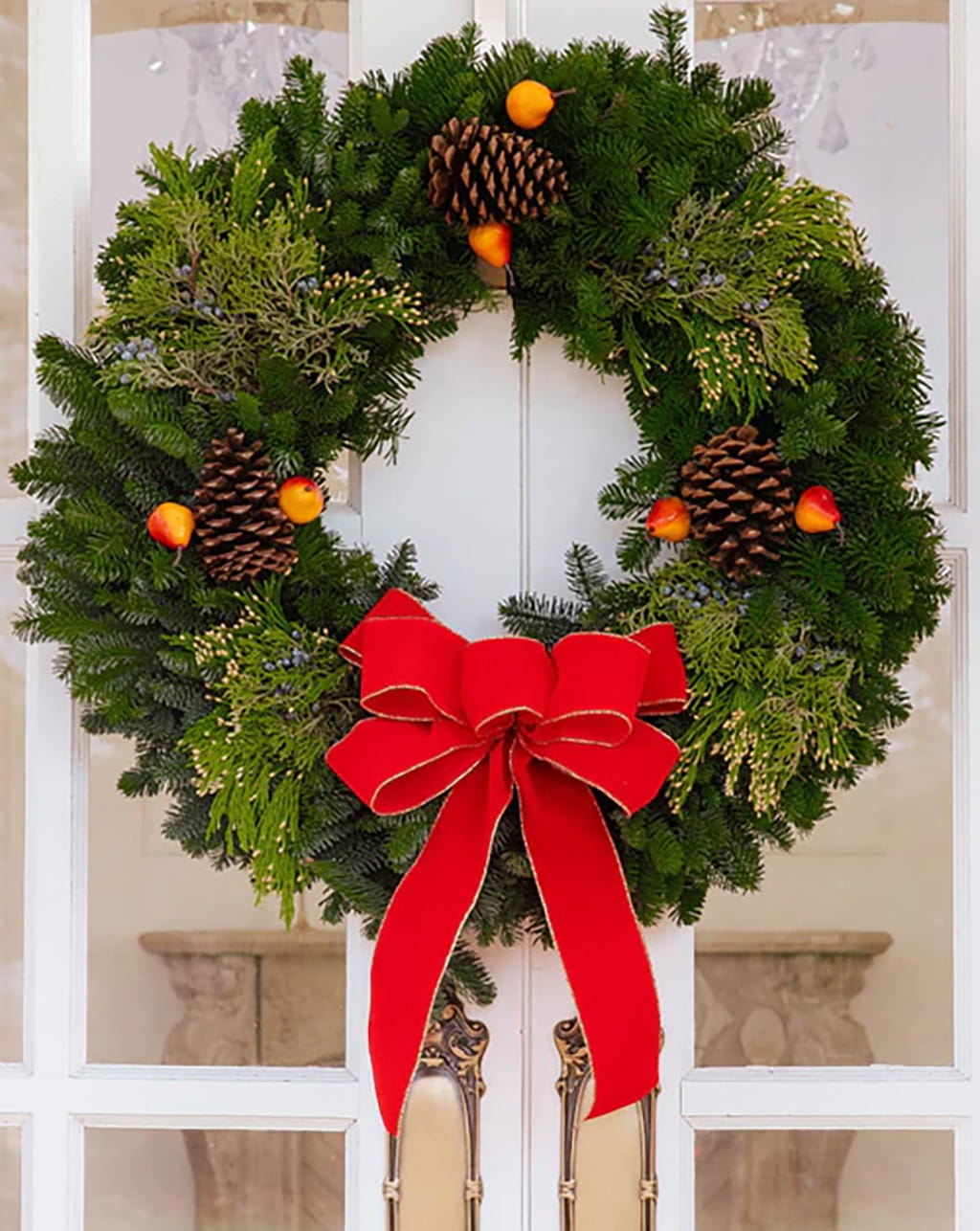 Traditional wreath with apples fresh greenery available in 24 to 26 inch sizes for Christmas decor and front door wreath